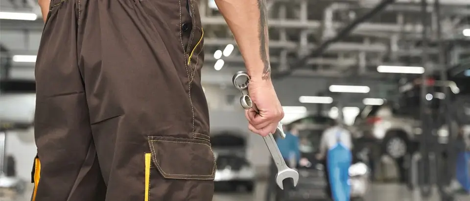 Mechanic Working on Car